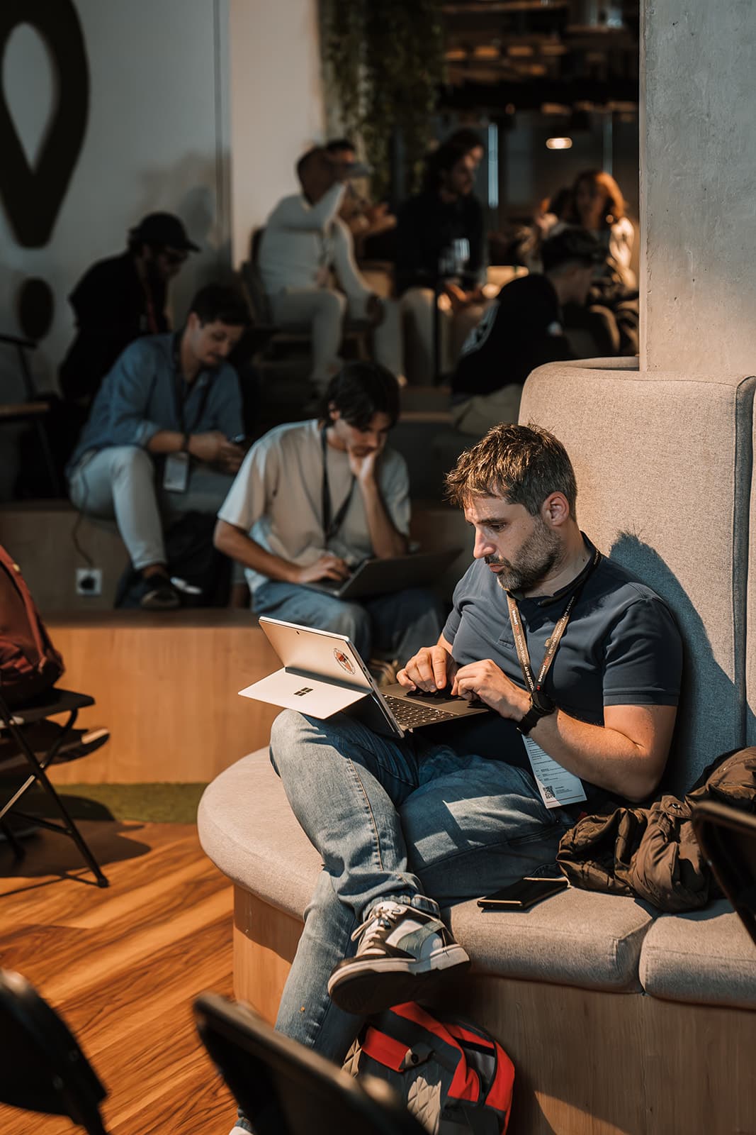 An attendee putting AI to work on a laptop between sessions