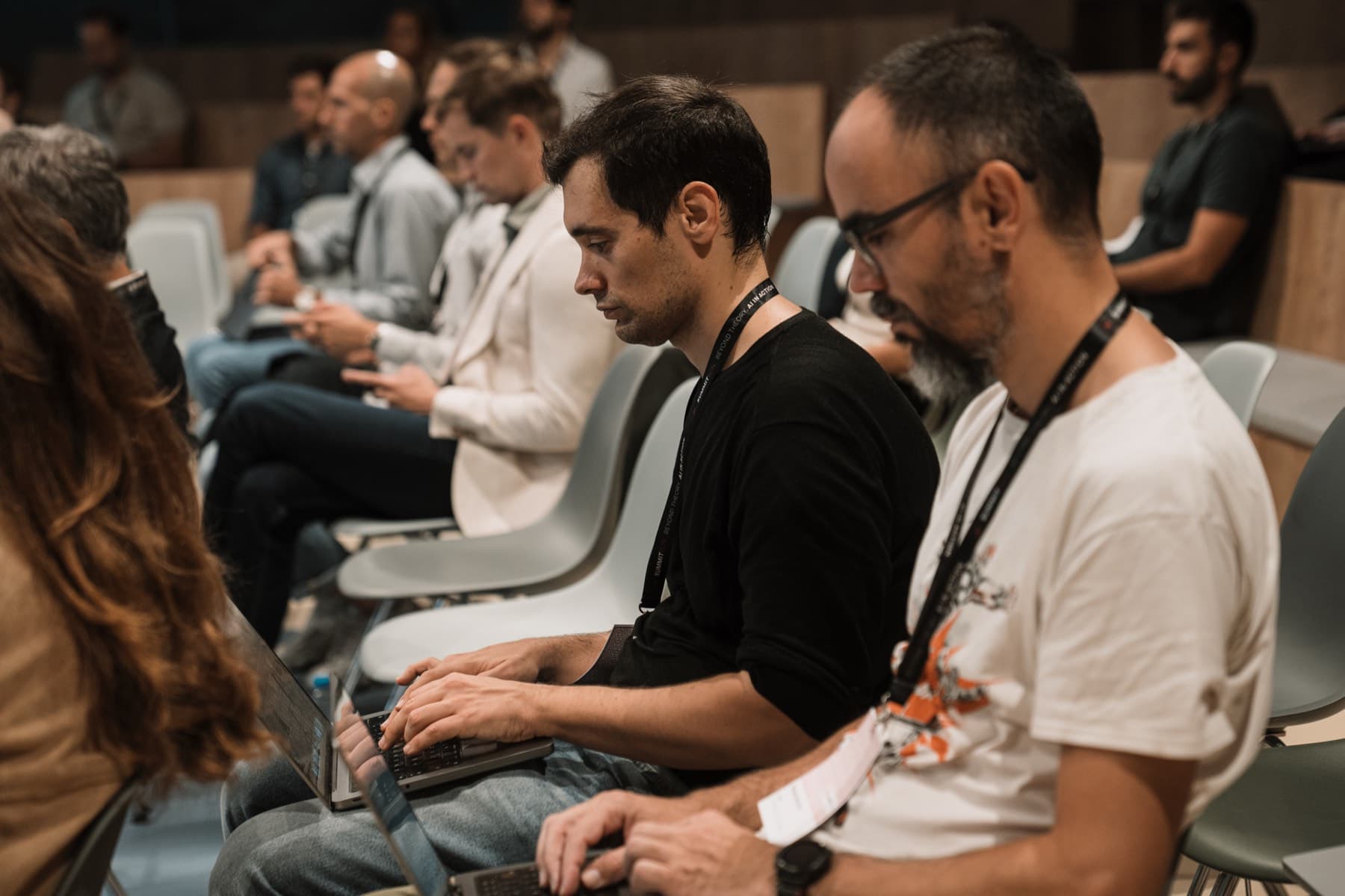 Attendees working through a hands-on workshop on their laptops