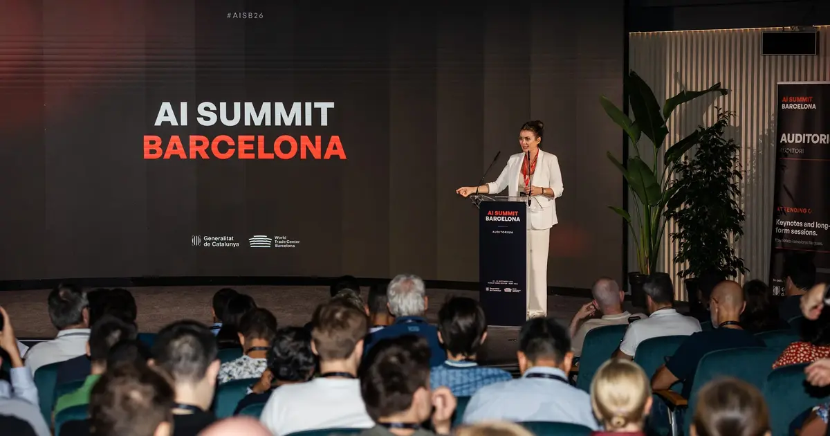 A wide view of the Summit stage and its seated audience.